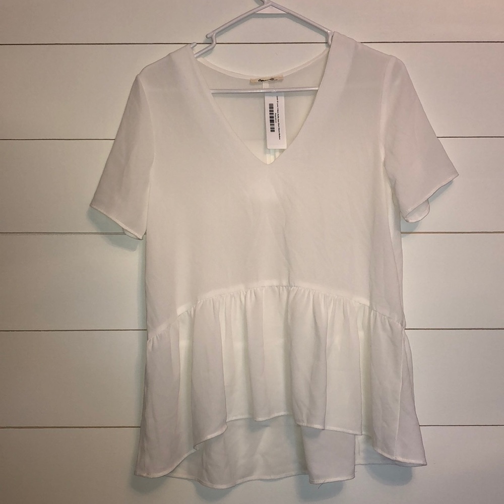 White peplum blouse with open back